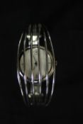 A boxed Calvin Klein six bar design fashion watch in box. H.10 W.8 D.7cm.