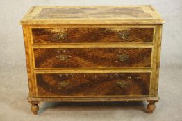 A Victorian painted pine chest, with faux wood grain effect, three long graduated drawers on