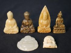 A collection of six carved Buddhas, including a bone Buddha head, jade Buddha, three carved
