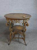 A late 19th/early 20th century circular wicker table, possibly French, with an oak top and