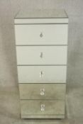 A contemporary mirrored chest of drawers of five drawers with glass knop handles, raised on plinth