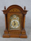 A late 19th / early 20th century inlaid oak cased dome topped Westminster chime mantle clock
