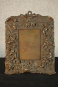 A late 19th/early 20th, possibly Italian cast bronze easel picture frame, with fiigural and putti