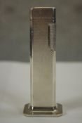 A 20th century silver plated table top Dunhill Tall Boy lighter with engine turned decoration,