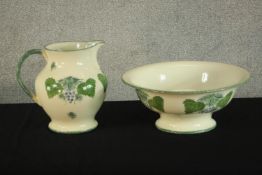 A 20th century Poole Pottery 'Vineyard' jug and bowl set, decorated with grapes and vine leaves. H.