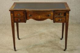 An Edwardian inlaid rosewood bowfronted leather topped writing desk, with single long drawer