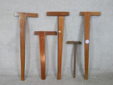 Five assorted 20th century mahogany draughtsman's T-squares. L.113cm (largest)