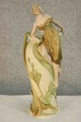 An Art Nouveau (early 20th century) Royal Dux porcelain figural vase, moulded with a classical