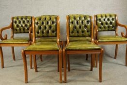 A set of six Yew wood Regency style button/quilted backed dining chairs comprised of four singles