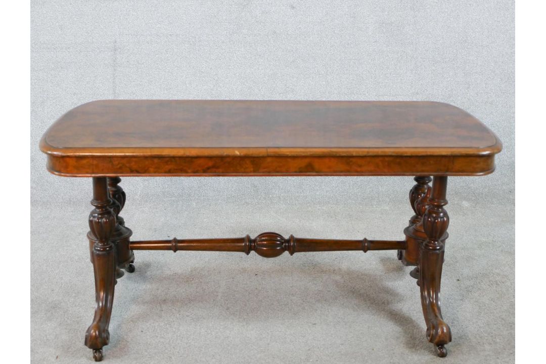 A 19th century walnut veneered centre table raised on two turned columns raised on outswept supports - Image 1 of 4