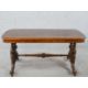 A 19th century walnut veneered centre table raised on two turned columns raised on outswept supports - Image 1 of 4