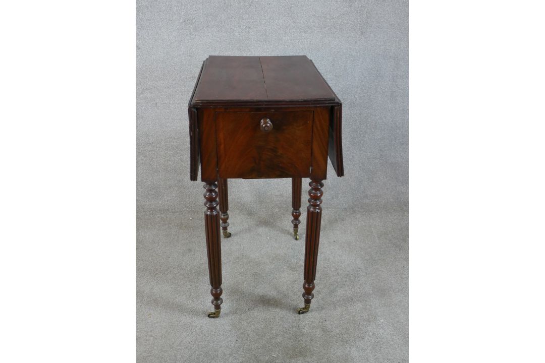 A 19th century mahogany drop leaf sewing table, with twin drawers to one end, raised on turned - Image 1 of 6