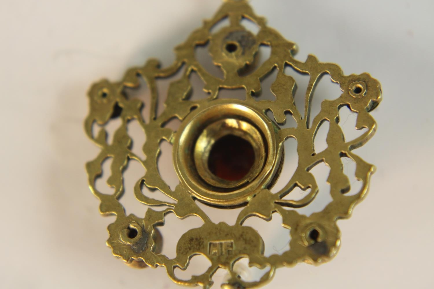 An early 20th century Austro-Hungarian gilt metal pierced foliate design pendant set with garnets - Image 6 of 9