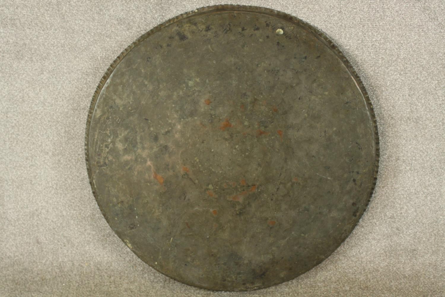 A late 19th/early 20th century engraved circular copper tray. Dia.65cm. - Image 5 of 5