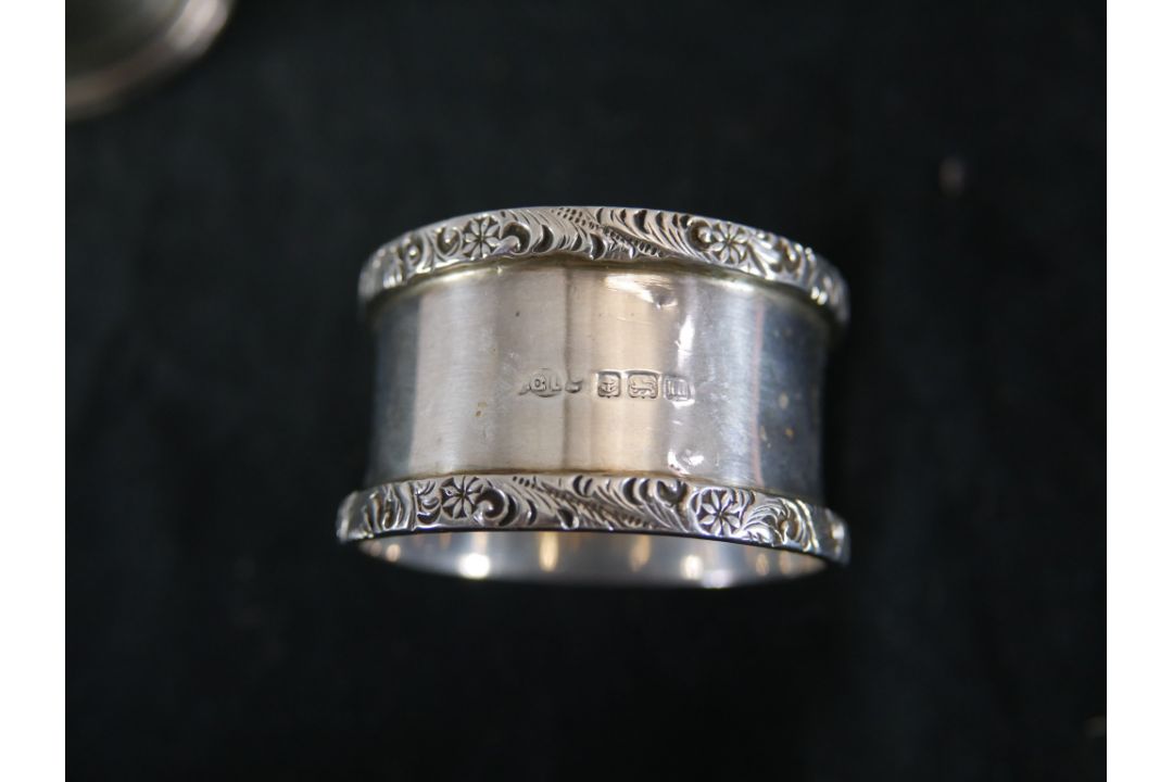 Seven assorted hallmarked silver napkin rings to include Coopers Brothers, Sheffield 1974; Joseph - Image 9 of 11
