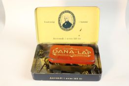 A collection of Danish silver, brass and white metal badges, buttons and pins.