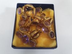 A silver gilt amethyst Etruscan style jewellery suite, including necklace, bracelet and brooch.