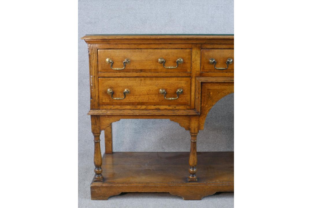 A 20th century oak five drawer sideboard with brass swing handles, raised on turned support with - Image 2 of 8