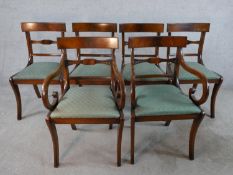 A set of six mahogany Regency style dining bar back comprised of four singles and two open arm