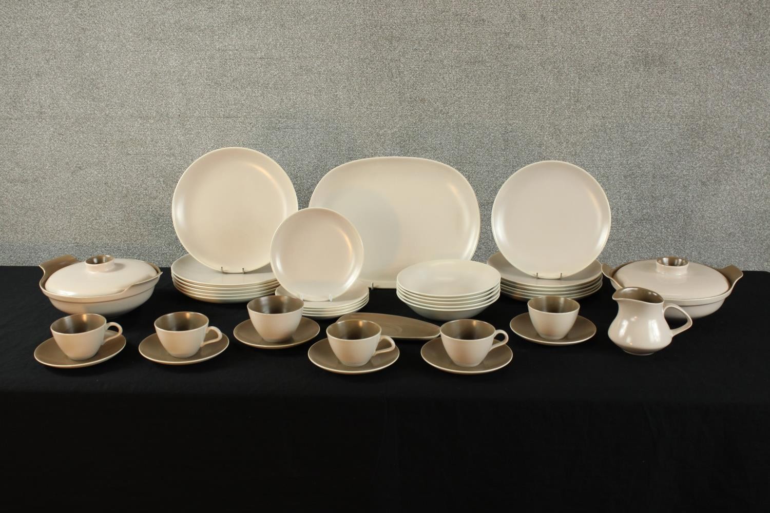 A 20th century Poole pottery brown twin tone six person part dinner set, marks verso. (39 pieces)