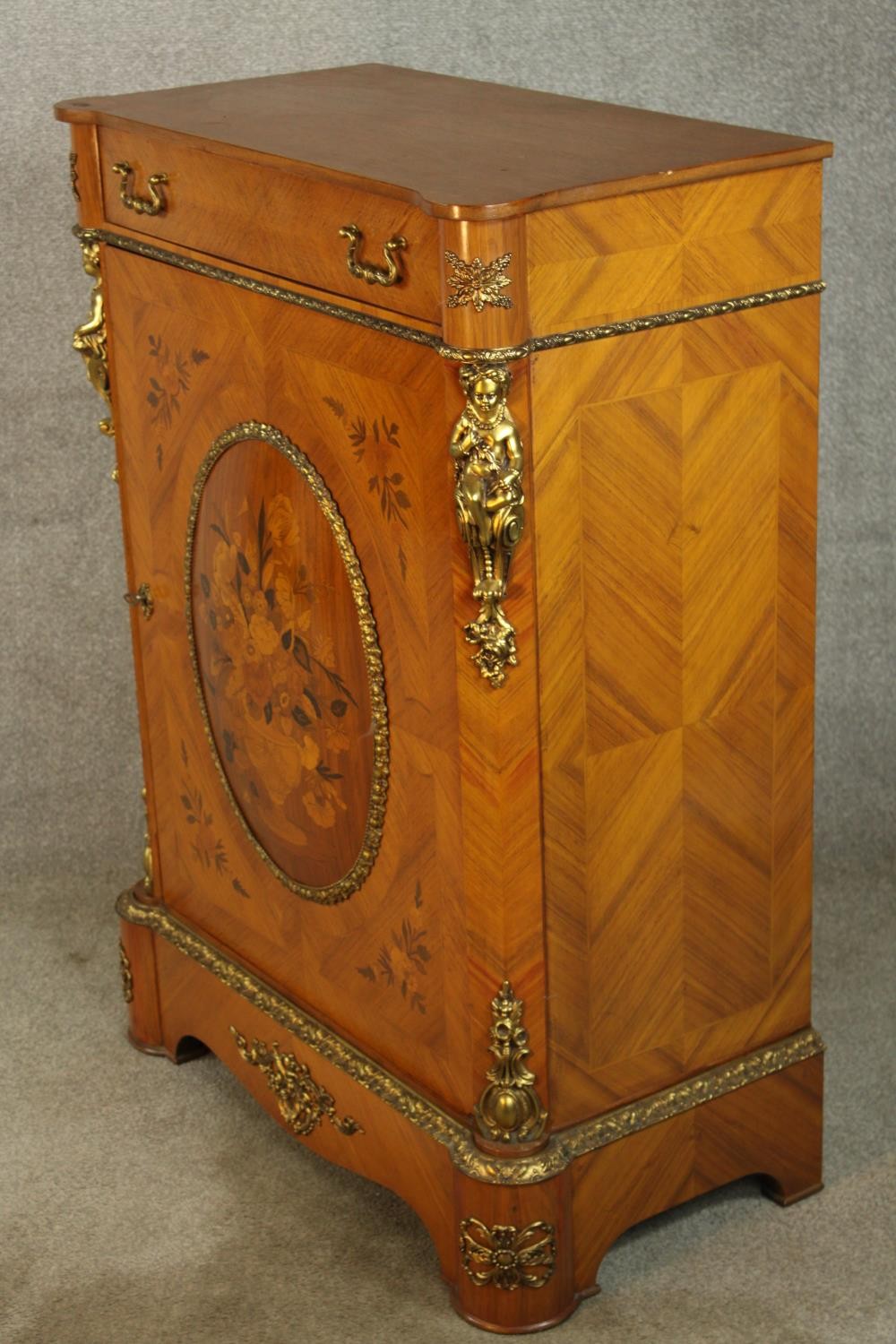 An 20th century French inlaid single door cabinet raised on shaped bracket feet, applied - Image 4 of 9