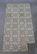 Thirty one 19th century painted and glazed square pottery tiles with geometric and leaf allover