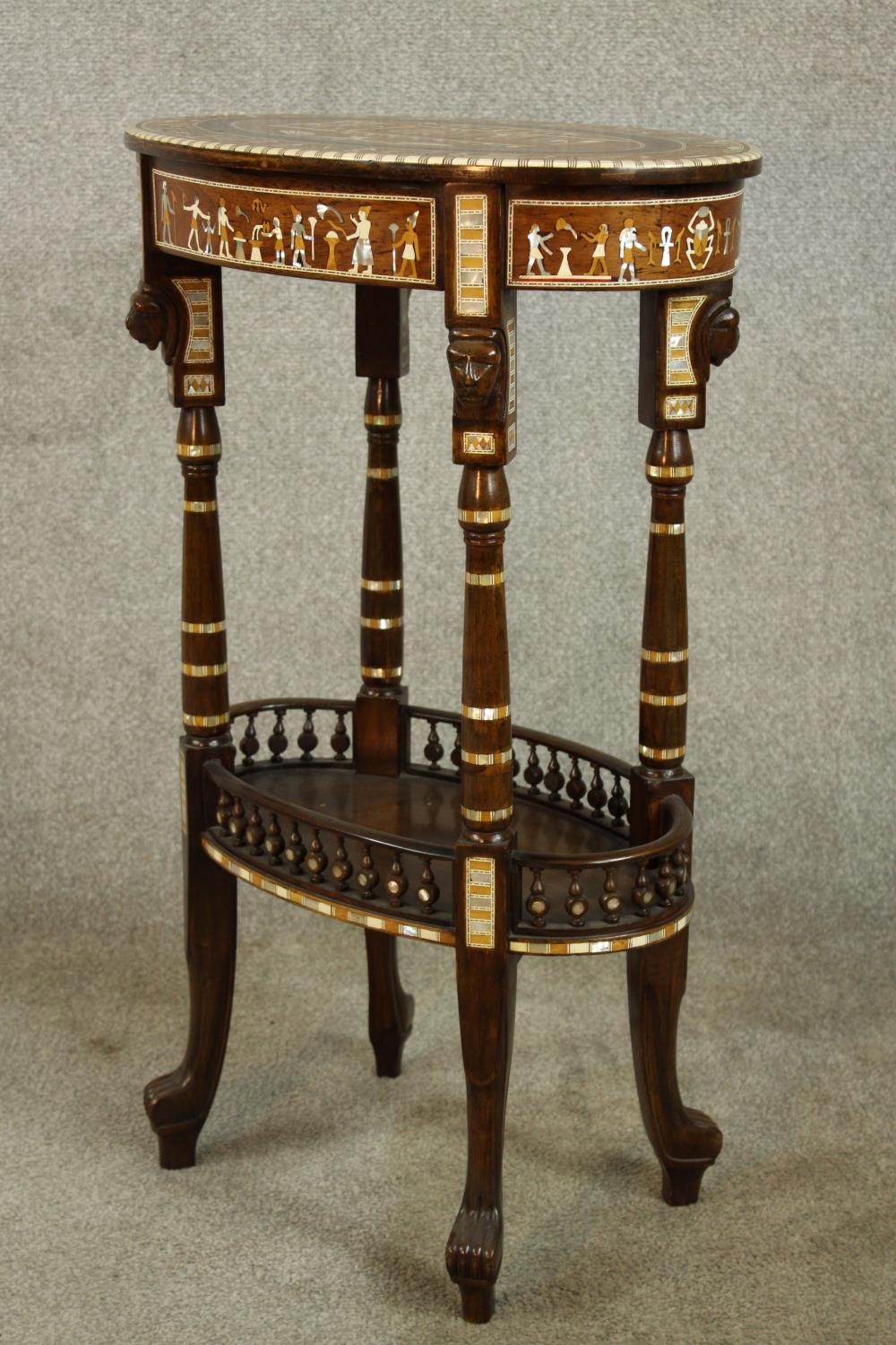 An early 20th century Egyptian Revival mahogany and ebony inlaid oval two tier side table raised - Image 6 of 8