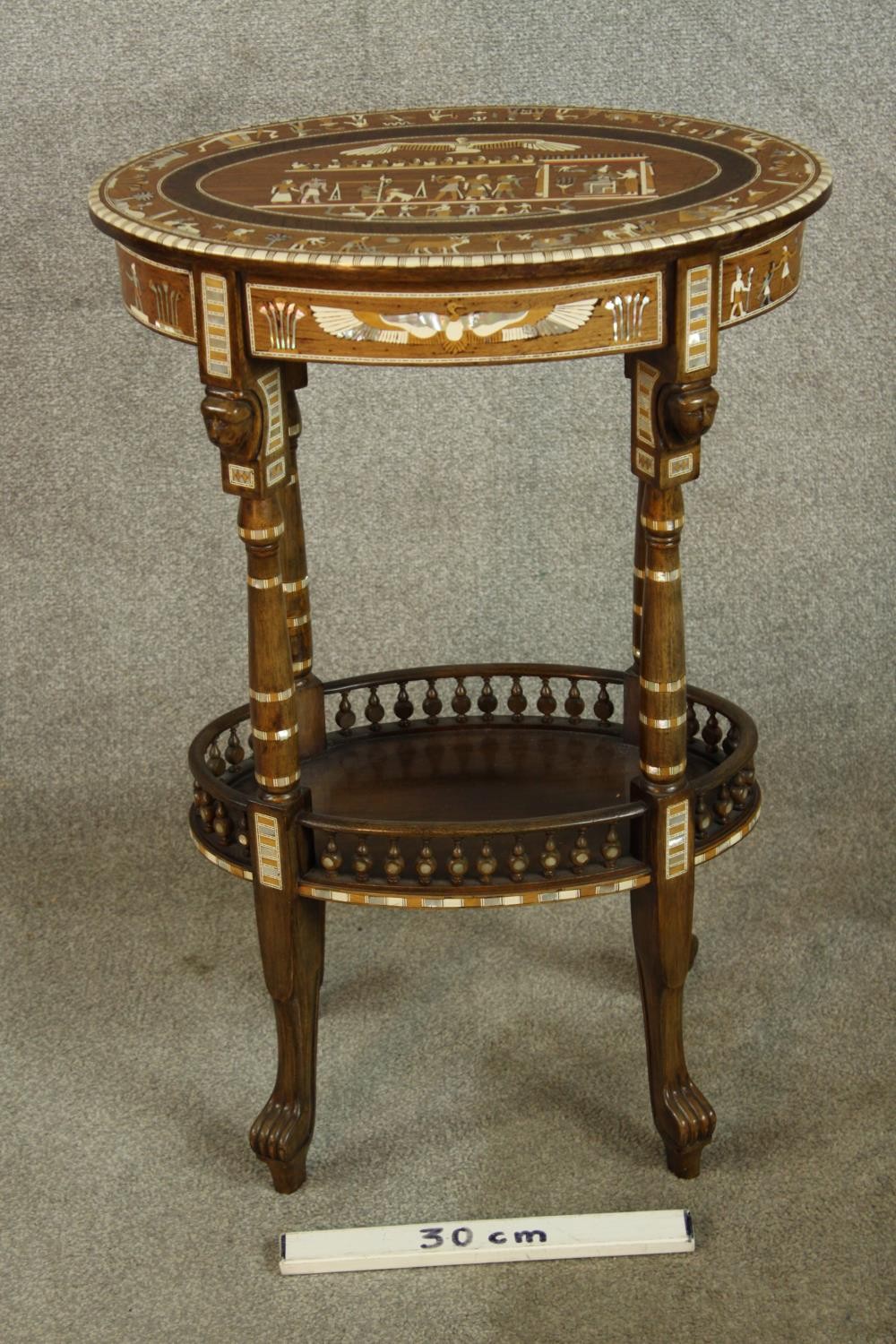 An early 20th century Egyptian Revival mahogany and ebony inlaid oval two tier side table raised - Image 3 of 8