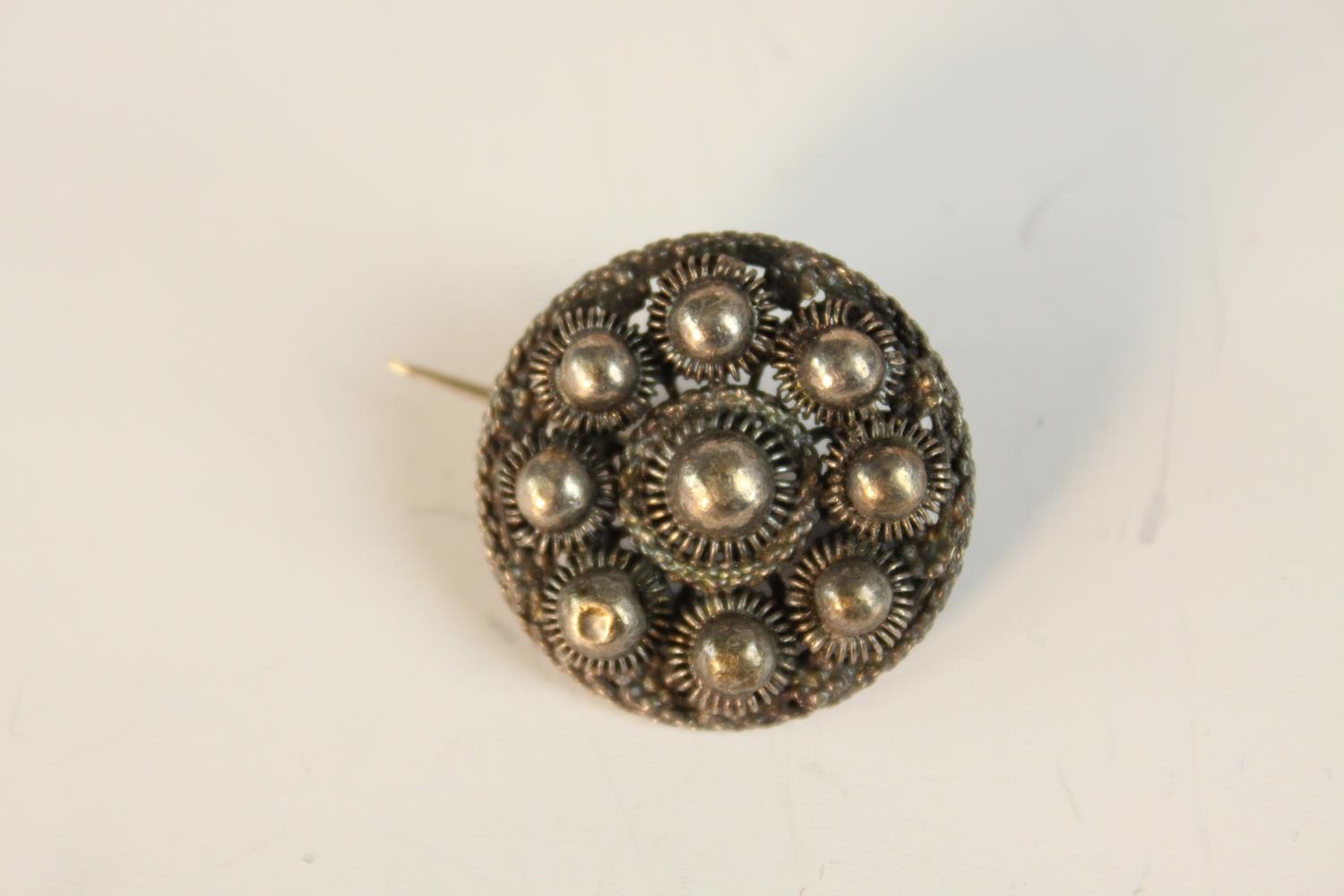 A collection of white metal and Danish silver brooches along with a peridot and marcasite set silver - Image 6 of 8