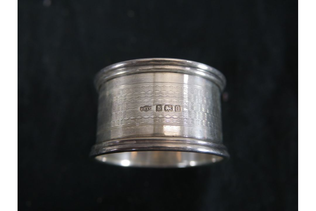 Seven assorted hallmarked silver napkin rings to include Coopers Brothers, Sheffield 1974; Joseph - Image 7 of 11