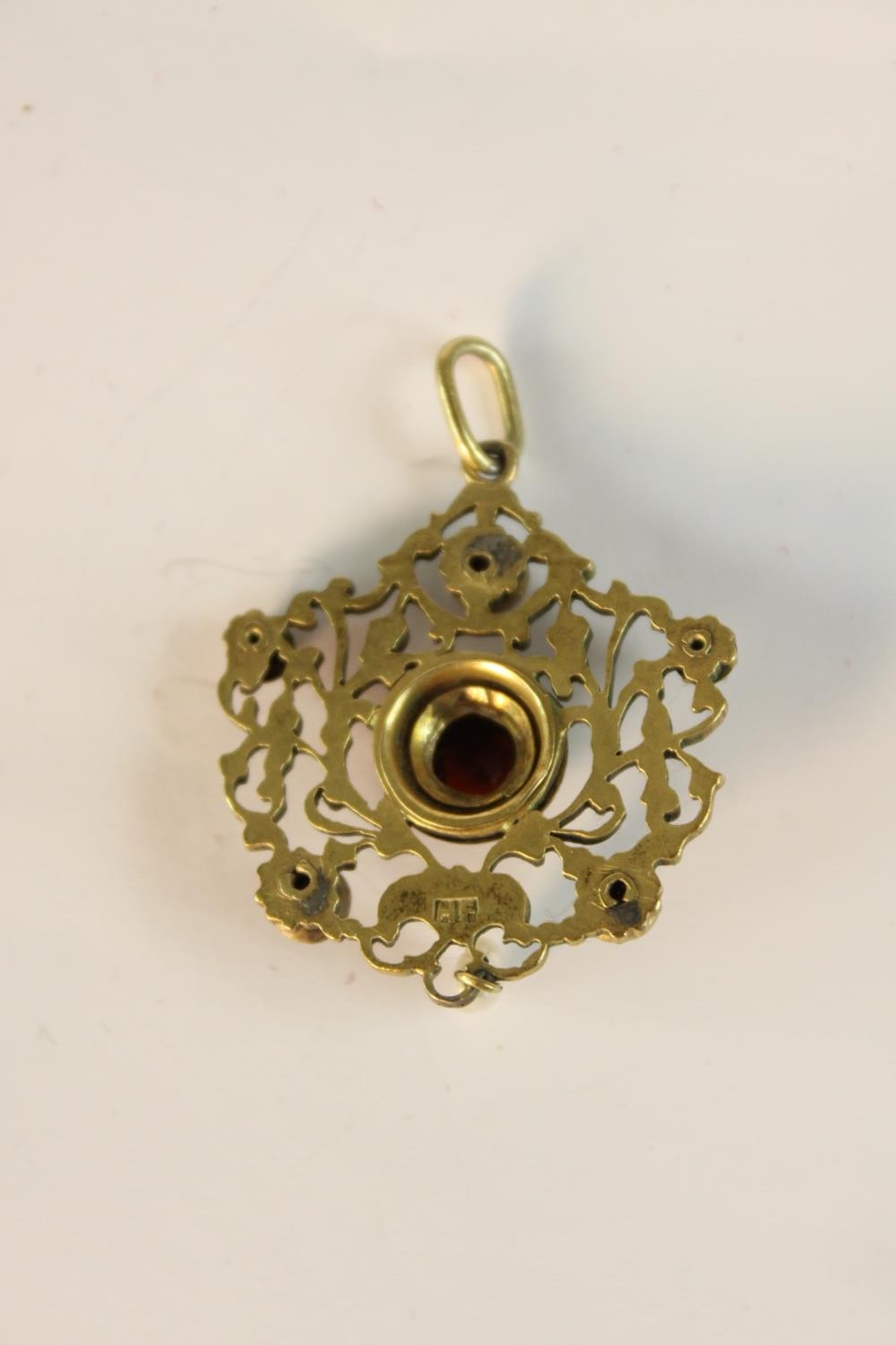 An early 20th century Austro-Hungarian gilt metal pierced foliate design pendant set with garnets - Image 5 of 9