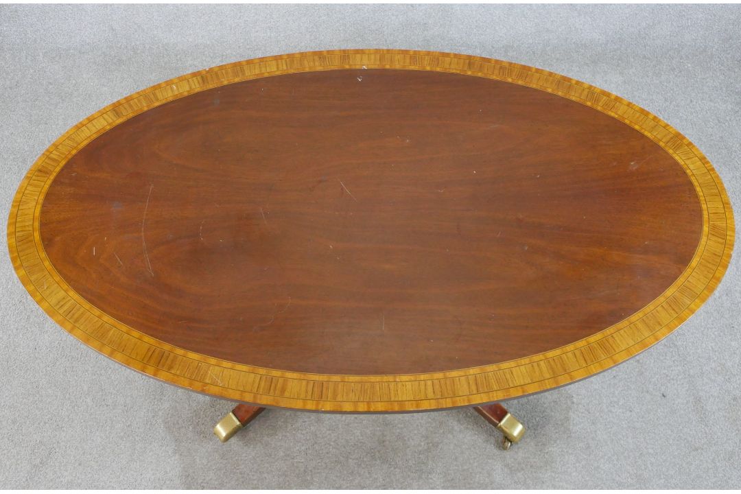 A Regency style inlaid mahogany oval coffee table raised on turned central column on four outswept - Image 3 of 6