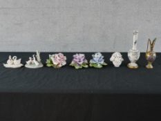 Various porcelain ornaments to include four floral encrusted ornaments, two swan porcelain swan