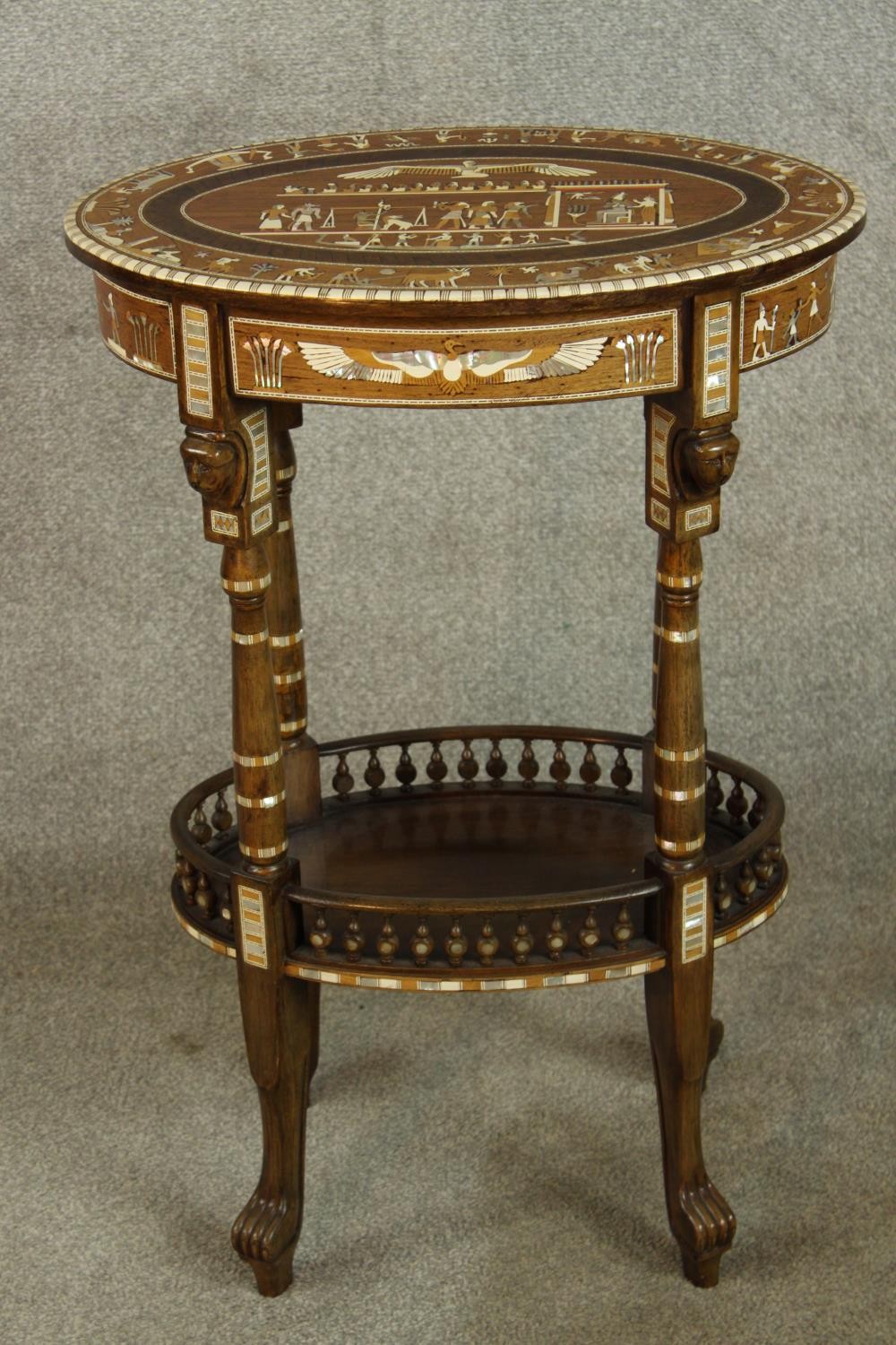 An early 20th century Egyptian Revival mahogany and ebony inlaid oval two tier side table raised - Image 2 of 8