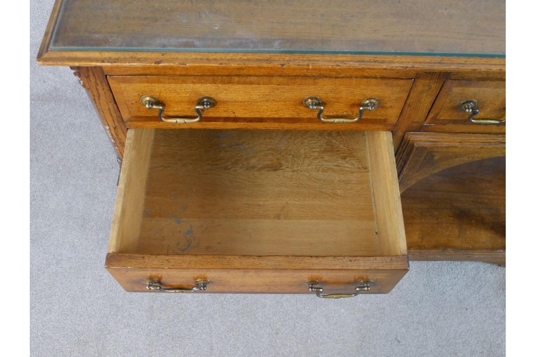 A 20th century oak five drawer sideboard with brass swing handles, raised on turned support with - Image 6 of 8