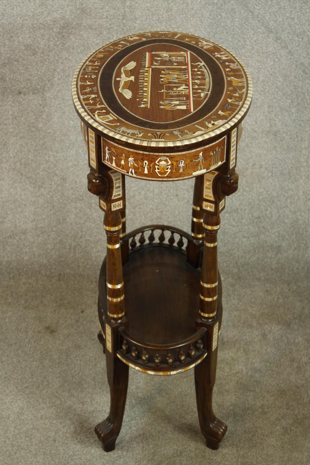 An early 20th century Egyptian Revival mahogany and ebony inlaid oval two tier side table raised - Image 5 of 8