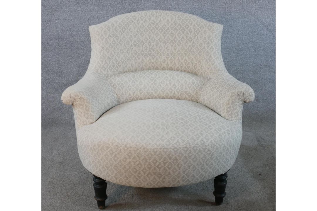 A 19th century mahogany framed nursing chair, upholstered in cream Dralon fabric raised on turned - Image 1 of 4