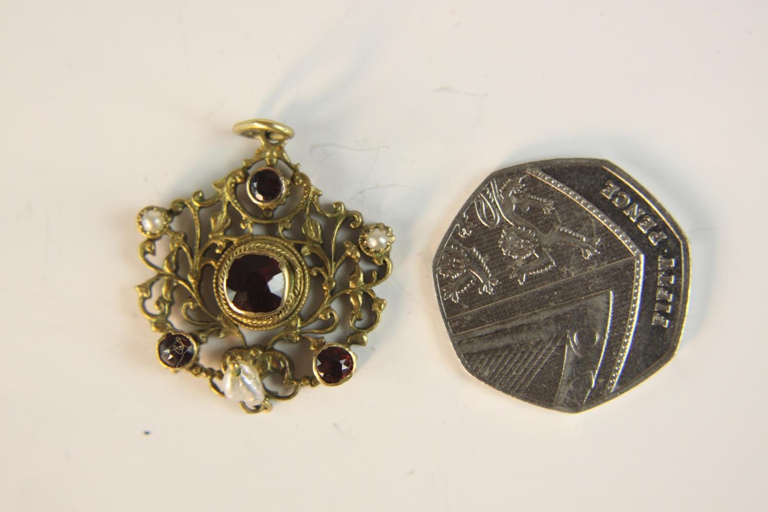 An early 20th century Austro-Hungarian gilt metal pierced foliate design pendant set with garnets - Image 9 of 9