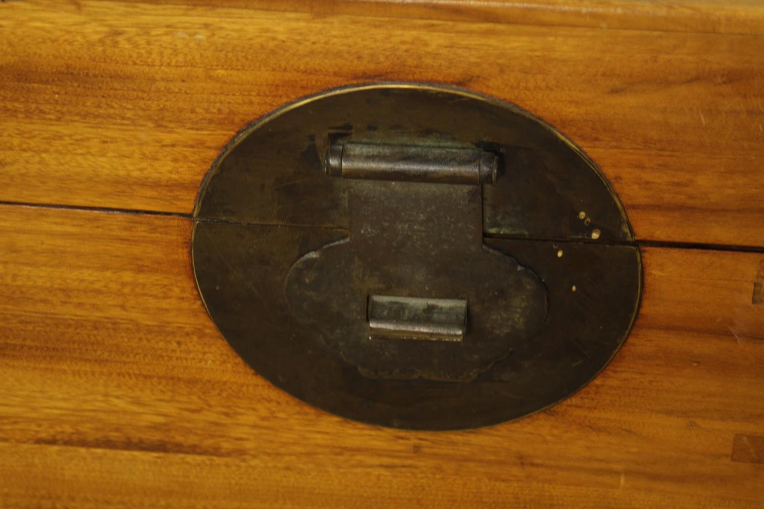 An early 20th century Chinese camphor wood twin handled box, with brass locking plate. H.46 W.91 D. - Image 6 of 6
