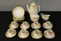 A 20th century Spode Fleur de Lys coffee set comprised of eight cups, saucers, cake plates, milk