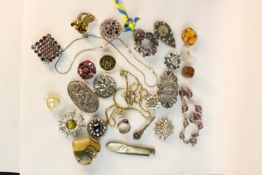 A collection of jewellery and other items, including a Swedish silver red paste set ring, carved