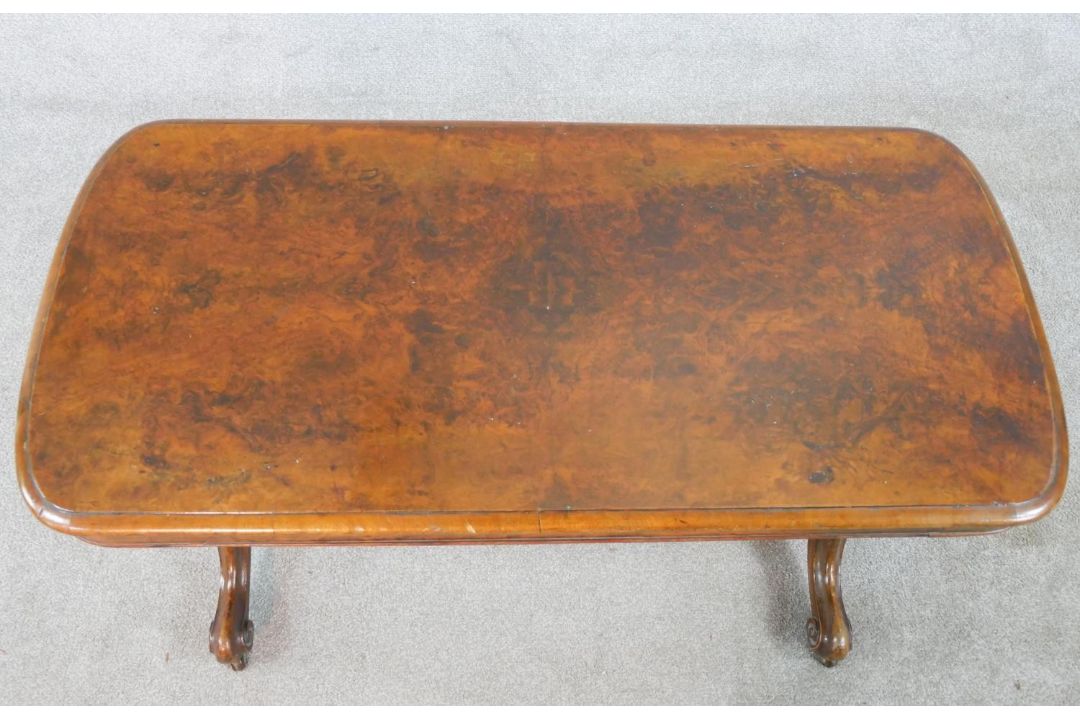 A 19th century walnut veneered centre table raised on two turned columns raised on outswept supports - Image 2 of 4