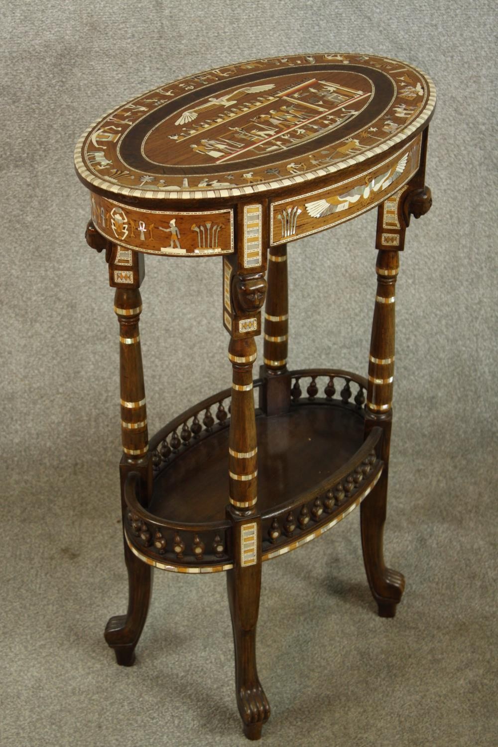 An early 20th century Egyptian Revival mahogany and ebony inlaid oval two tier side table raised - Image 4 of 8