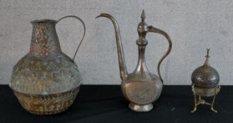 A 20th century Middle Easten brass coffee pot, together with an Middle Easten embossed brass water