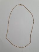 An 18 inch 9ct gold fine trace chain with secure C-sprung clasp. Stamped 375, Italian assay marks.