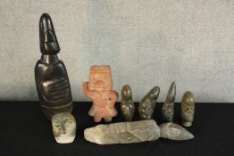 Eight assorted stone figures to include a Mexican clay figure and various Inuit stone carvings. H.