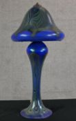 A 20th century Loetz style blue glass mushroom shaped table lamp, with iridescent abstract