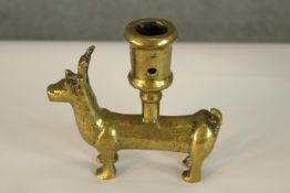 A German, possibly Medieval 15th century, small brass zoomorphic candleholder cast in the form of a