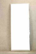 A contemporary white framed wall mirror. H.198 W.78cm.