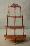 A Victorian figured walnut with foliate carving Whatnot. H.116 W.70cm.